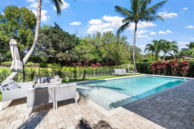 a view of a patio with swimming pool