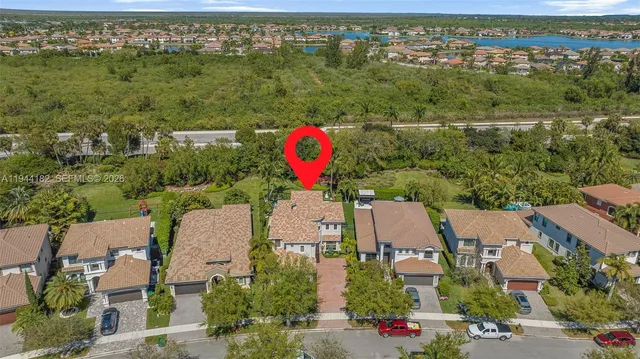 an aerial view of residential houses with outdoor space