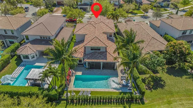 an aerial view of residential houses with outdoor space