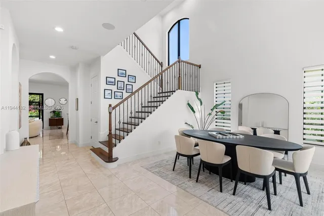 a view of a a dining room with furniture and window