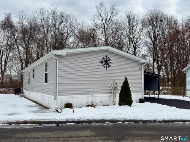 a view of house with backyard