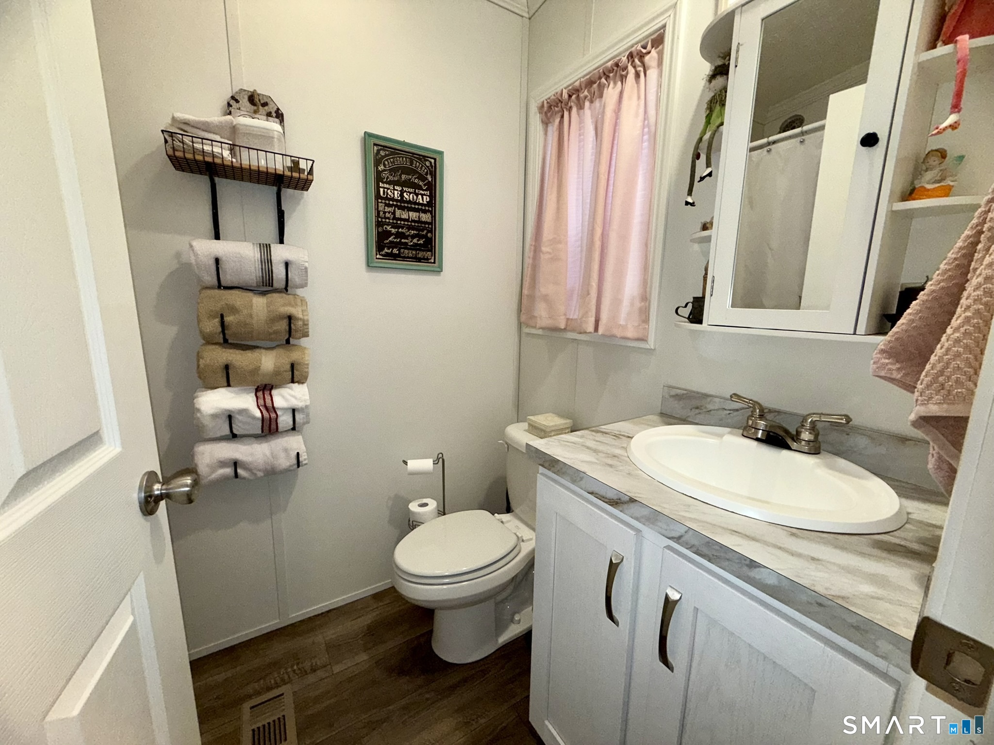 40 Matthews Street Bristol, CT 06010 - Photo 10 of 15 a bathroom with a toilet sink and mirror