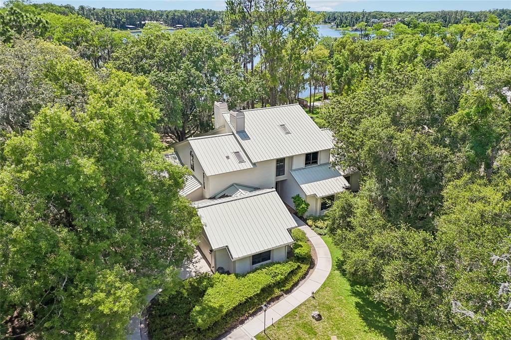 17810 Crawley Road Odessa, FL 33556 - Photo 68 of 76 an aerial view of a house with a yard and trees