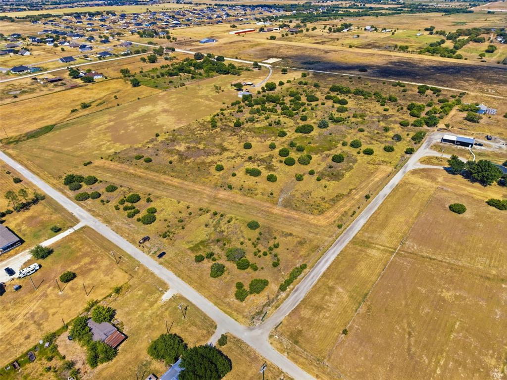 6940 Lonesome Road Godley, TX 76044 - Photo 6 of 14 Expansive undeveloped land featuring natural foliage and a dirt road entrance
