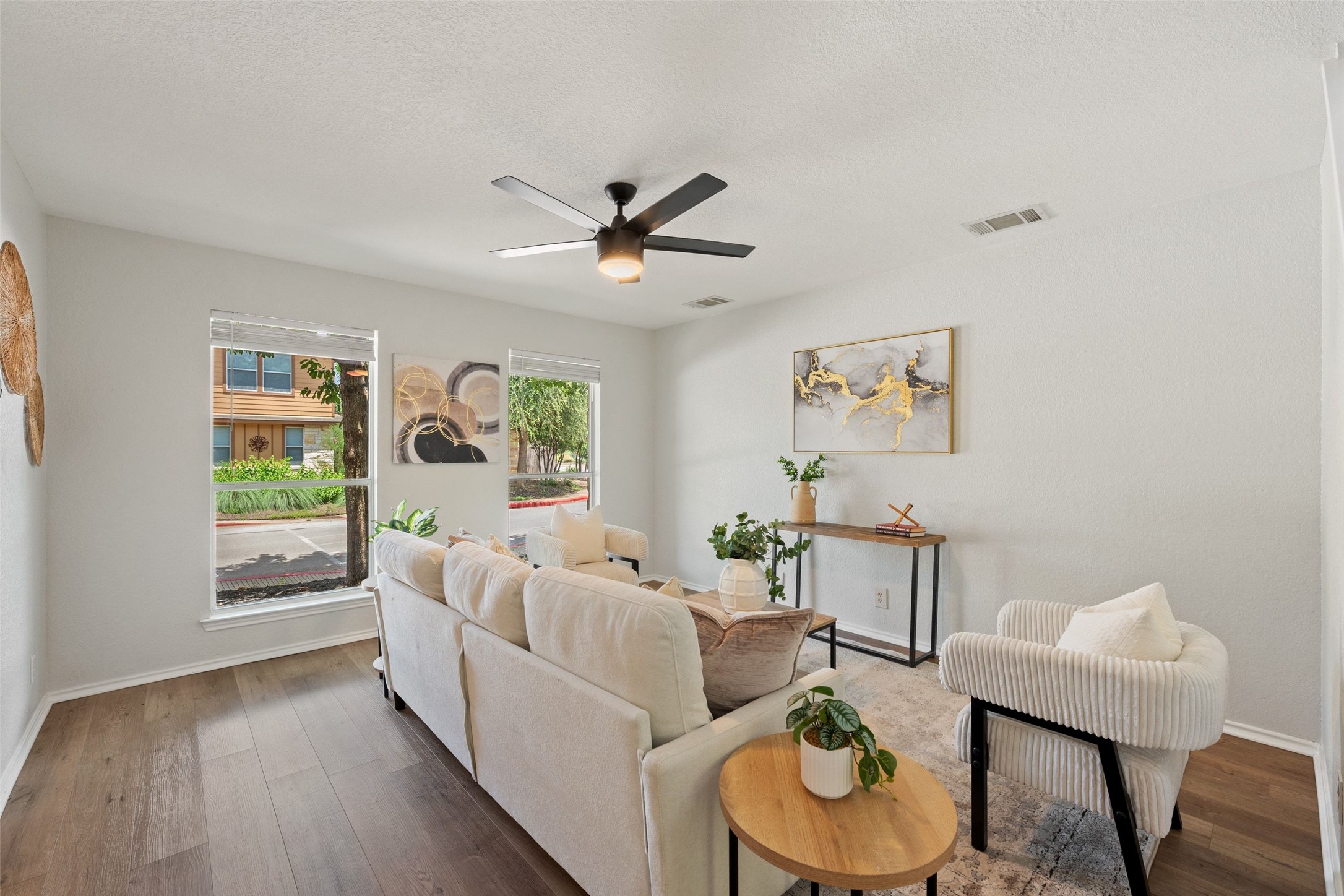 4529 Best Way Austin, TX 78725 - Photo 5 of 34 Main living area with large windows that let in a ton of natural light