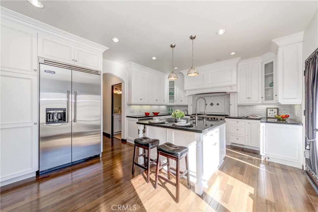 950 Old Mill Road Pasadena, CA 91108 - Photo 15 of 42 a kitchen with stainless steel appliances a stove a sink a refrigerator and chairs