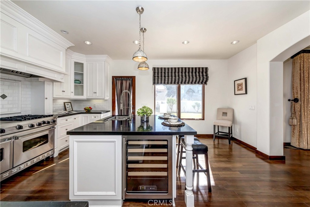 950 Old Mill Road Pasadena, CA 91108 - Photo 16 of 42 a kitchen with stainless steel appliances granite countertop a stove and a refrigerator