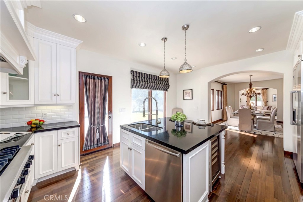 950 Old Mill Road Pasadena, CA 91108 - Photo 17 of 42 a kitchen that has a lot of cabinets and wooden floor