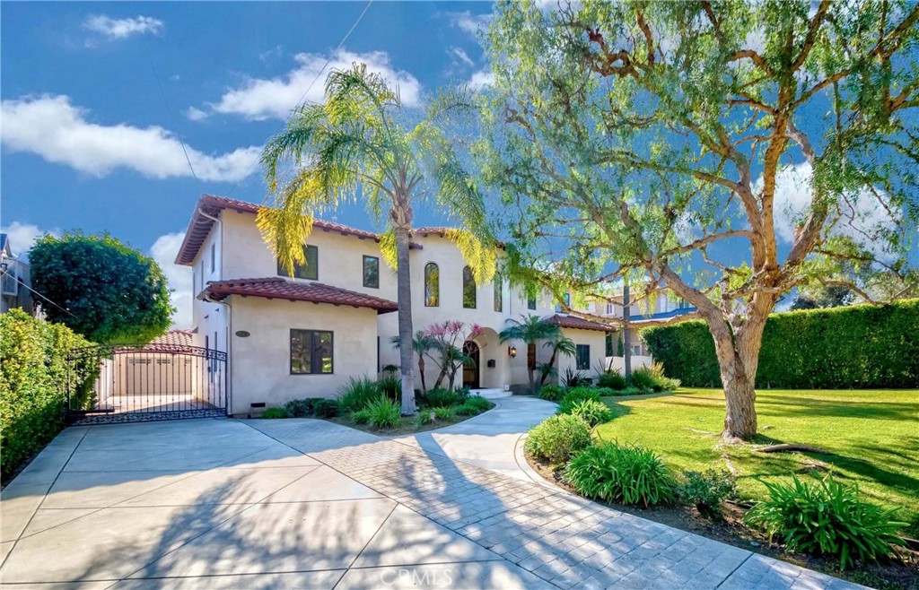 950 Old Mill Road Pasadena, CA 91108 - Photo 2 of 42 a house that has a tree in front of it