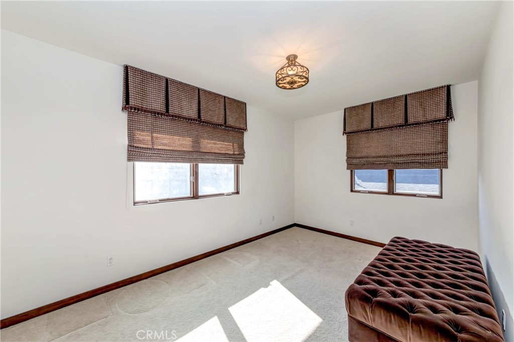 950 Old Mill Road Pasadena, CA 91108 - Photo 31 of 42 a bedroom with a bed and a window