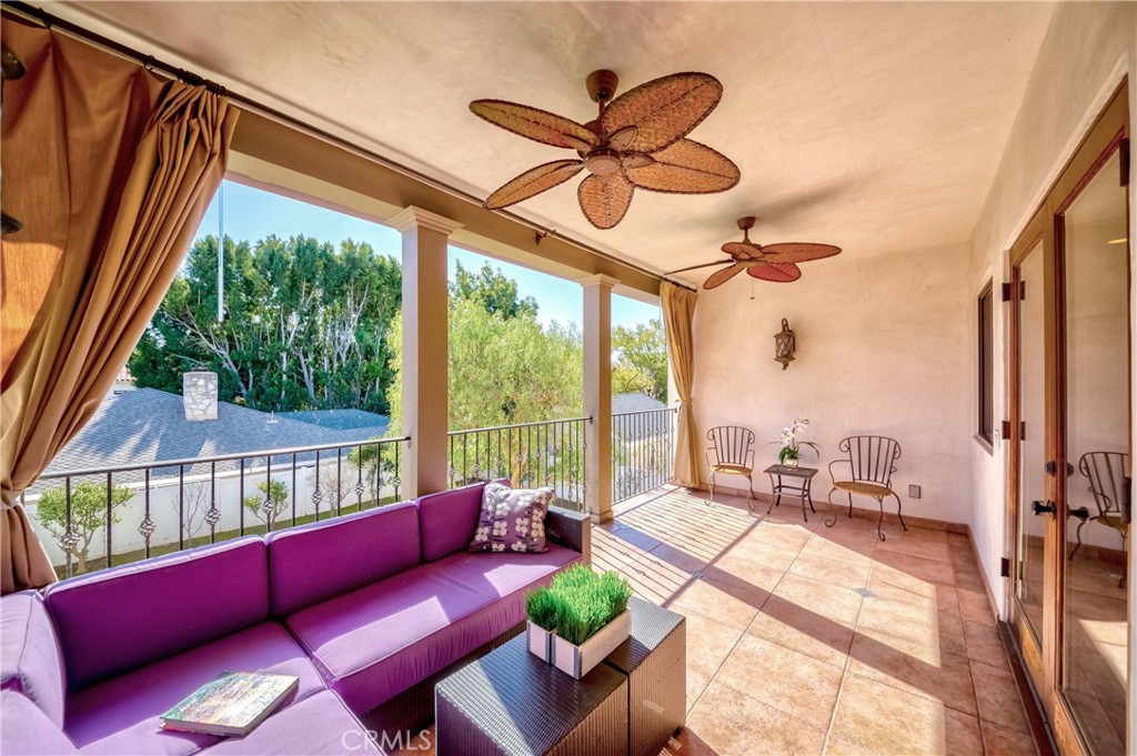 950 Old Mill Road Pasadena, CA 91108 - Photo 35 of 42 a living room with furniture a ceiling fan and a large window