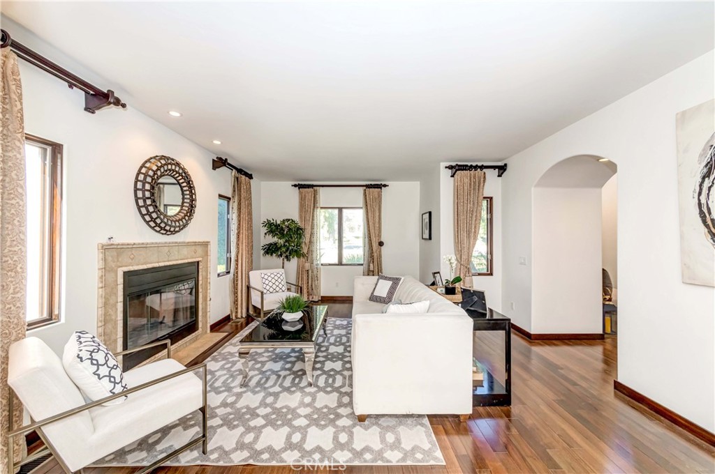 950 Old Mill Road Pasadena, CA 91108 - Photo 8 of 42 a living room with furniture a fireplace and wooden floor