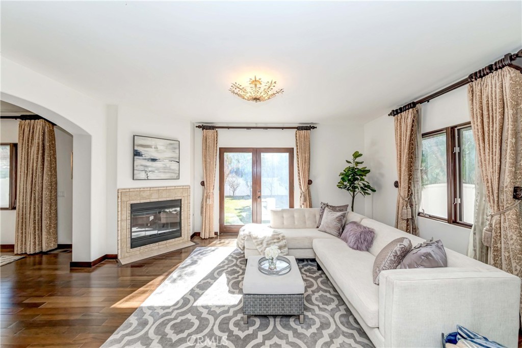 950 Old Mill Road Pasadena, CA 91108 - Photo 9 of 42 a living room with furniture and a fireplace
