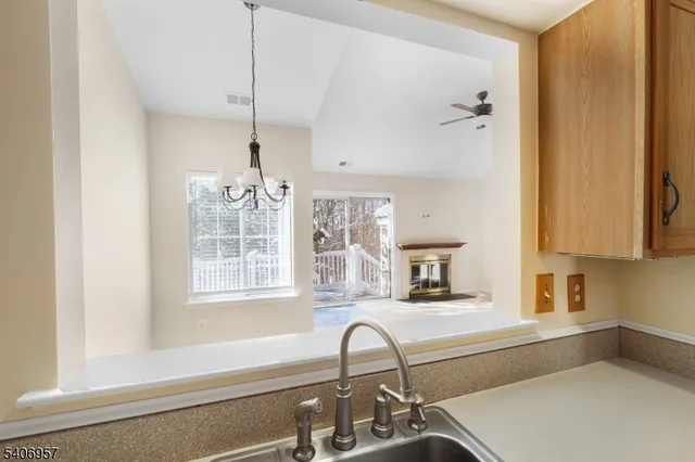 a kitchen with a sink and a window