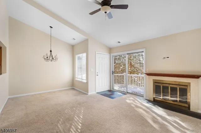 a view of livingroom with hardwood floor and a ceiling fan