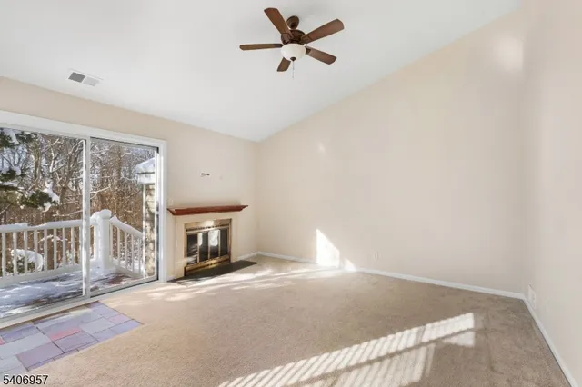 a bedroom with a bed and a ceiling fan