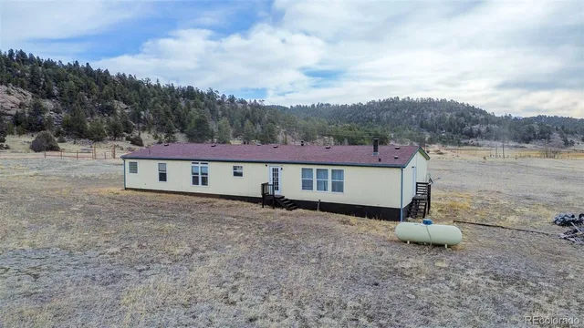 a view of a backyard of a house