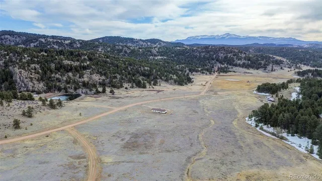 a view of a backyard with wooden fence