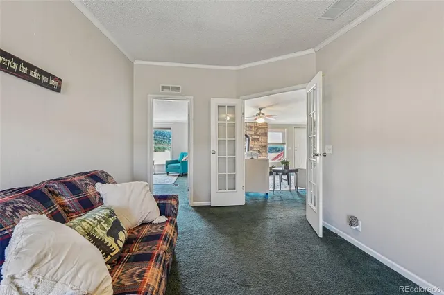 a bedroom with a bed and a couch