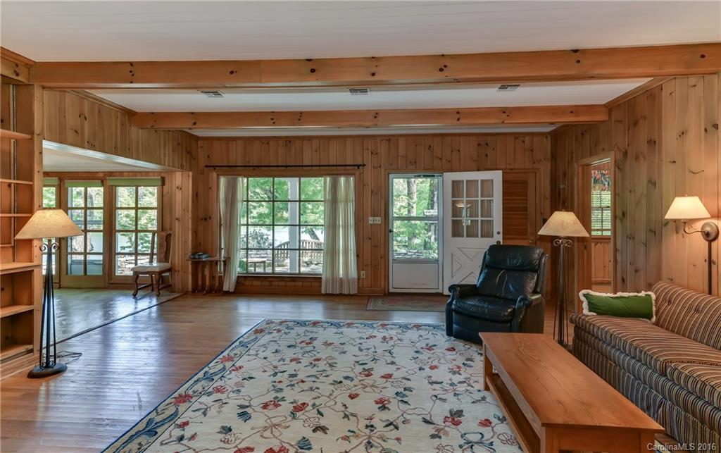 711 Green Hills Road Mill Spring, NC 28756 - Photo 11 of 23 a living room with furniture and a fireplace