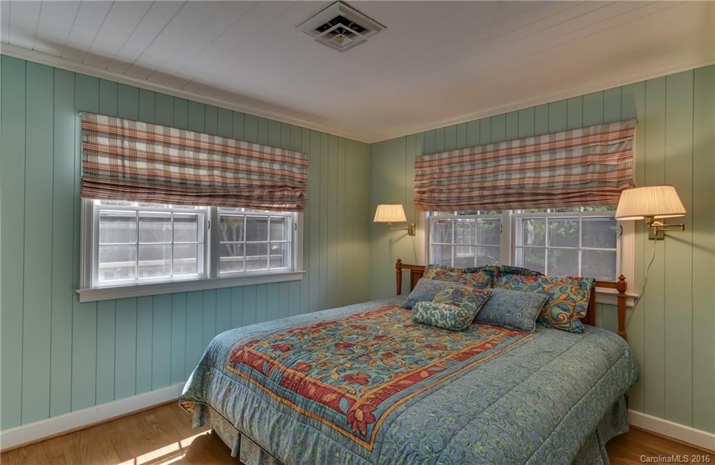 711 Green Hills Road Mill Spring, NC 28756 - Photo 16 of 23 a bedroom with a bed and window