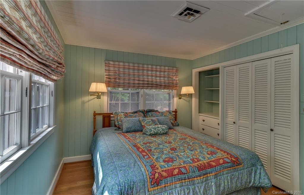 711 Green Hills Road Mill Spring, NC 28756 - Photo 17 of 23 a bedroom with a bed and a large window