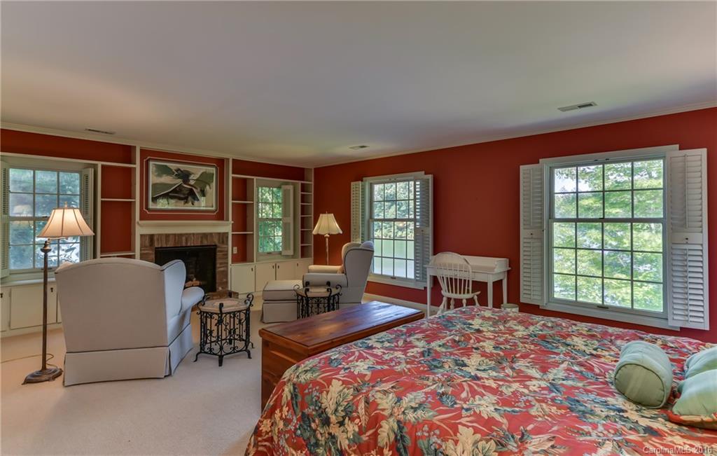 711 Green Hills Road Mill Spring, NC 28756 - Photo 21 of 23 a bedroom with a bed and a window