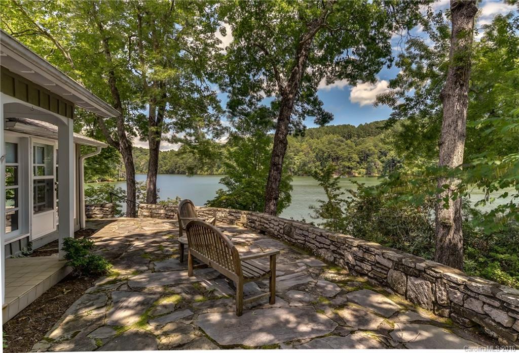 711 Green Hills Road Mill Spring, NC 28756 - Photo 4 of 23 a view of a backyard with sitting area