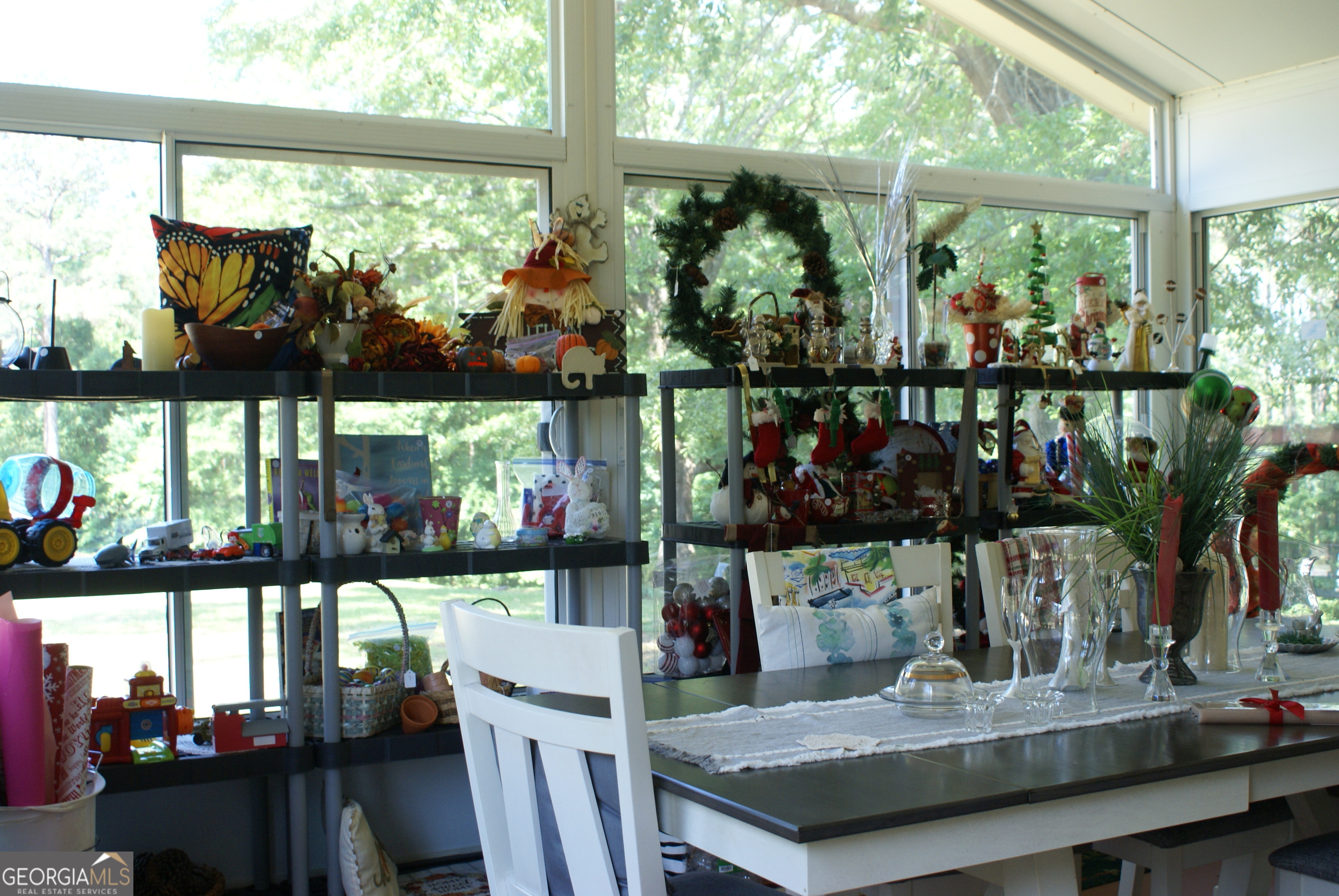 1591 Waymanville Road Thomaston, GA 30286 - Photo 12 of 24 a view of a dining table with chairs and a table in a patio