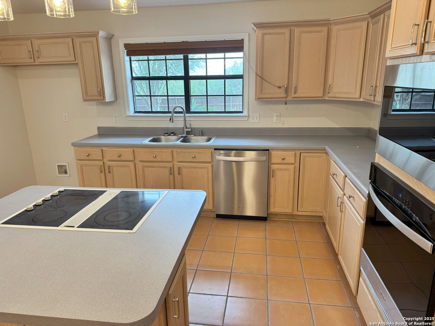136 Lk Vw Terrace Three Rivers, TX 78071 - Photo 5 of 20 a kitchen with a sink a stove and cabinets