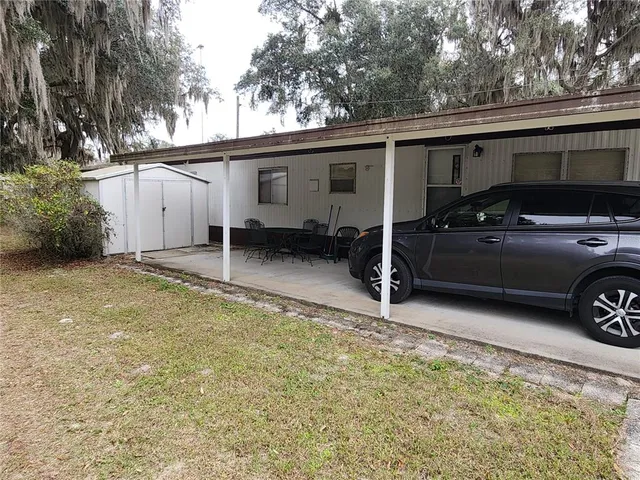 a view of a house with a bed and a couch