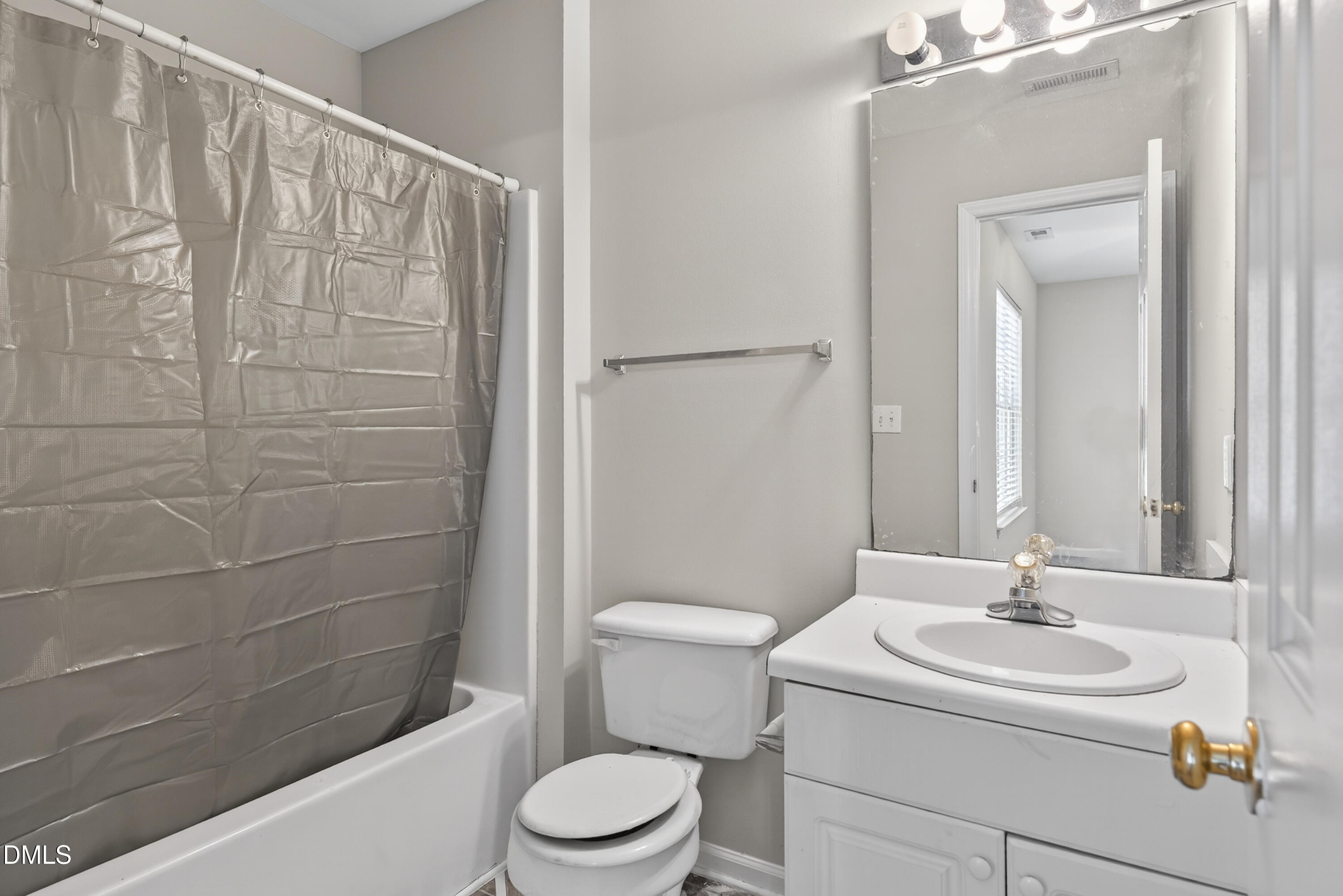 1601 Briarmont Court Raleigh, NC 27610 - Photo 24 of 30 a bathroom with a sink a toilet and shower