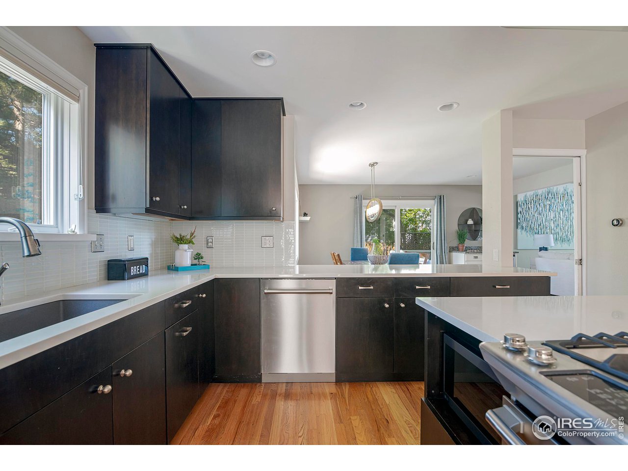 476 Locust Place Boulder, CO 80304 - Photo 11 of 38 a kitchen with a sink stove top oven and cabinets