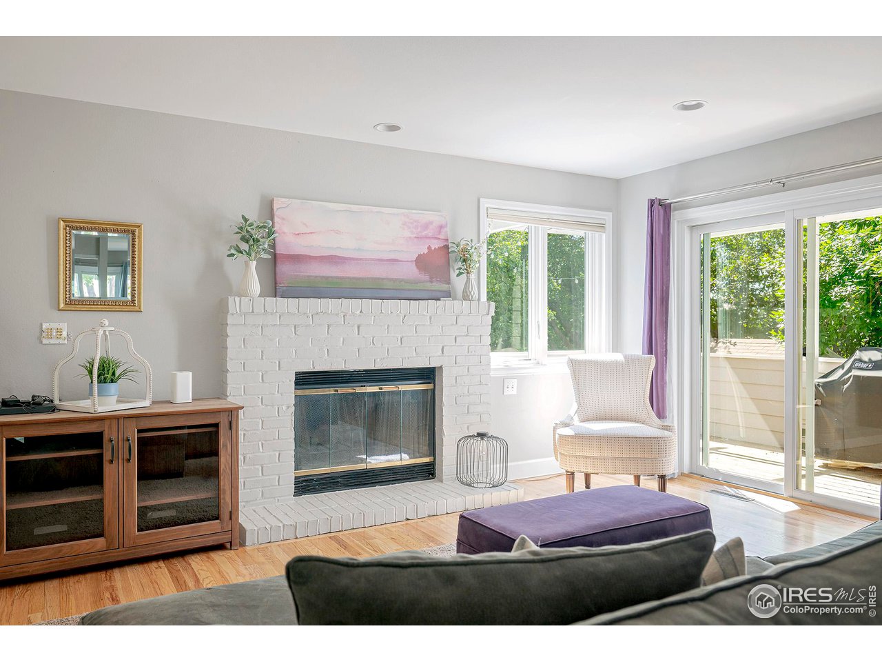 476 Locust Place Boulder, CO 80304 - Photo 14 of 38 a living room with furniture and a fireplace