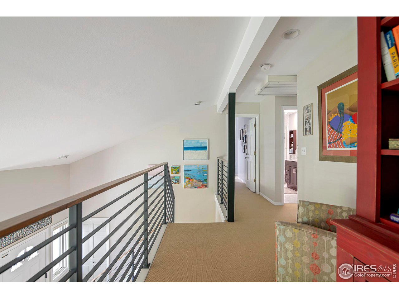 476 Locust Place Boulder, CO 80304 - Photo 16 of 38 a view of a hallway with wooden floor and furniture