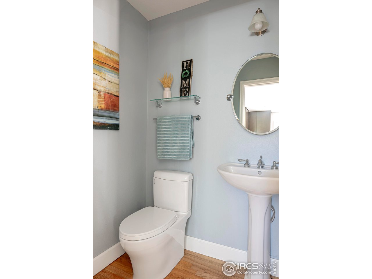 476 Locust Place Boulder, CO 80304 - Photo 17 of 38 a bathroom with a toilet sink and mirror