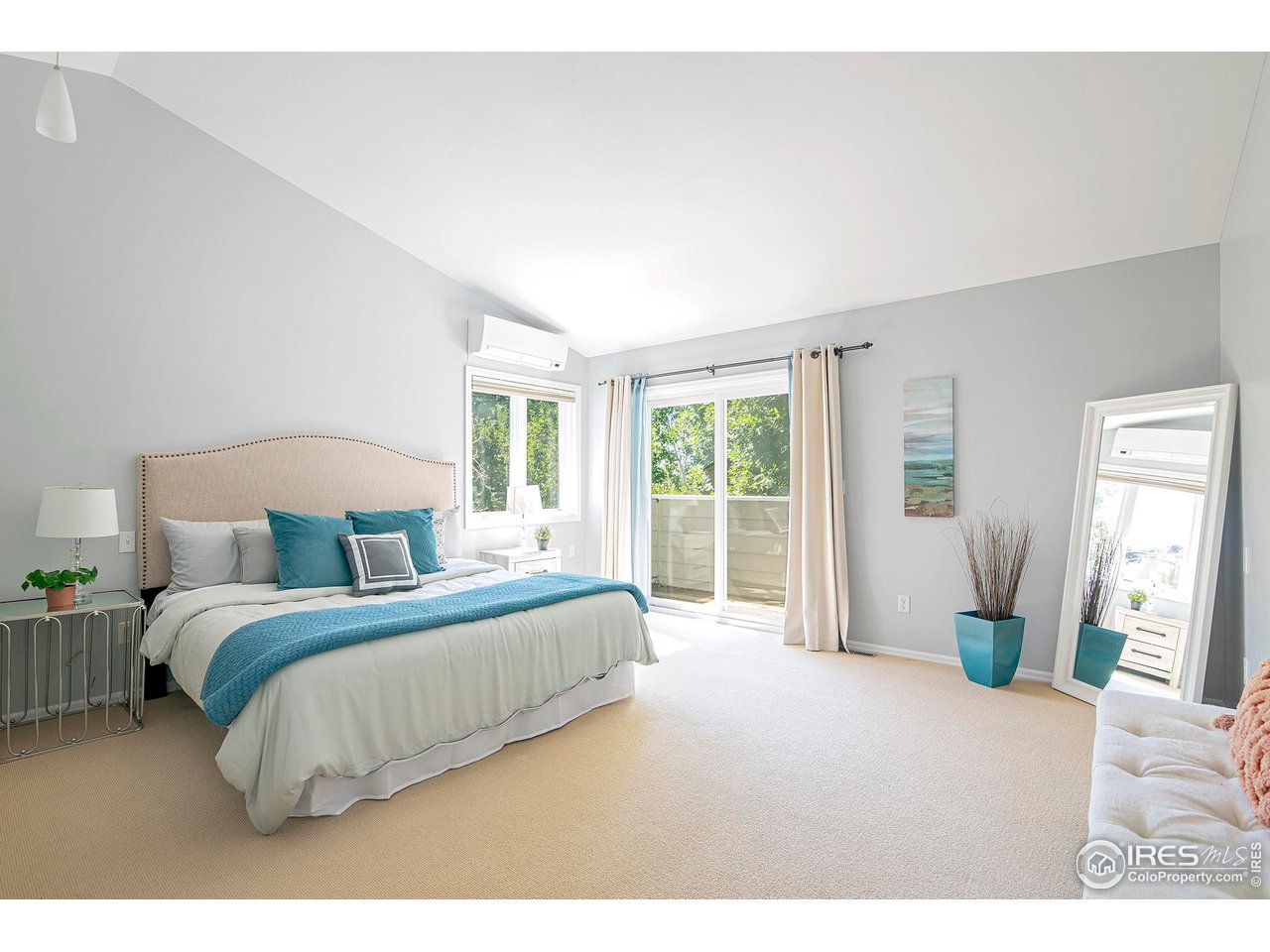 476 Locust Place Boulder, CO 80304 - Photo 20 of 38 a bedroom with a bed and a large window