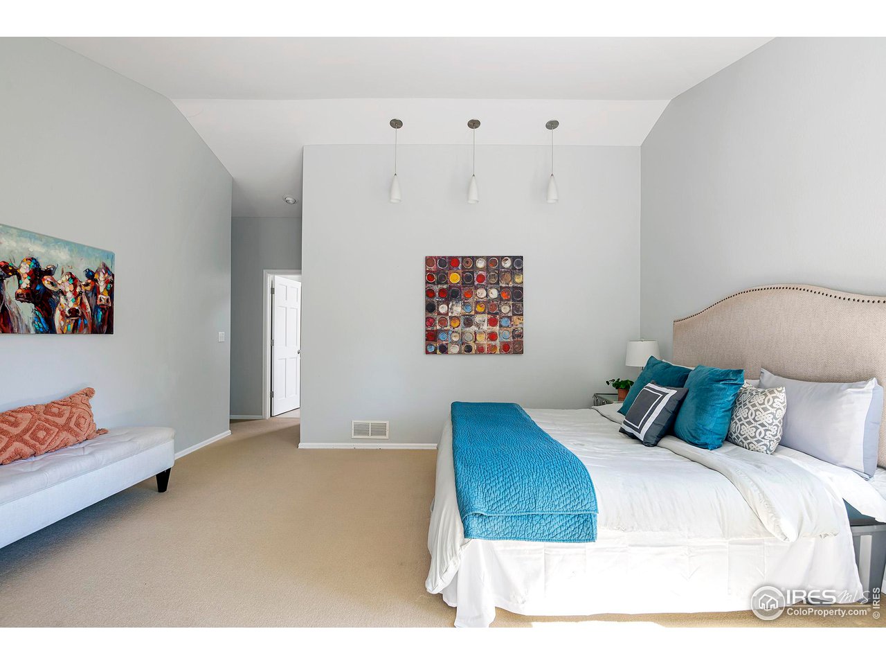 476 Locust Place Boulder, CO 80304 - Photo 21 of 38 a bedroom with a bed and painting on the wall