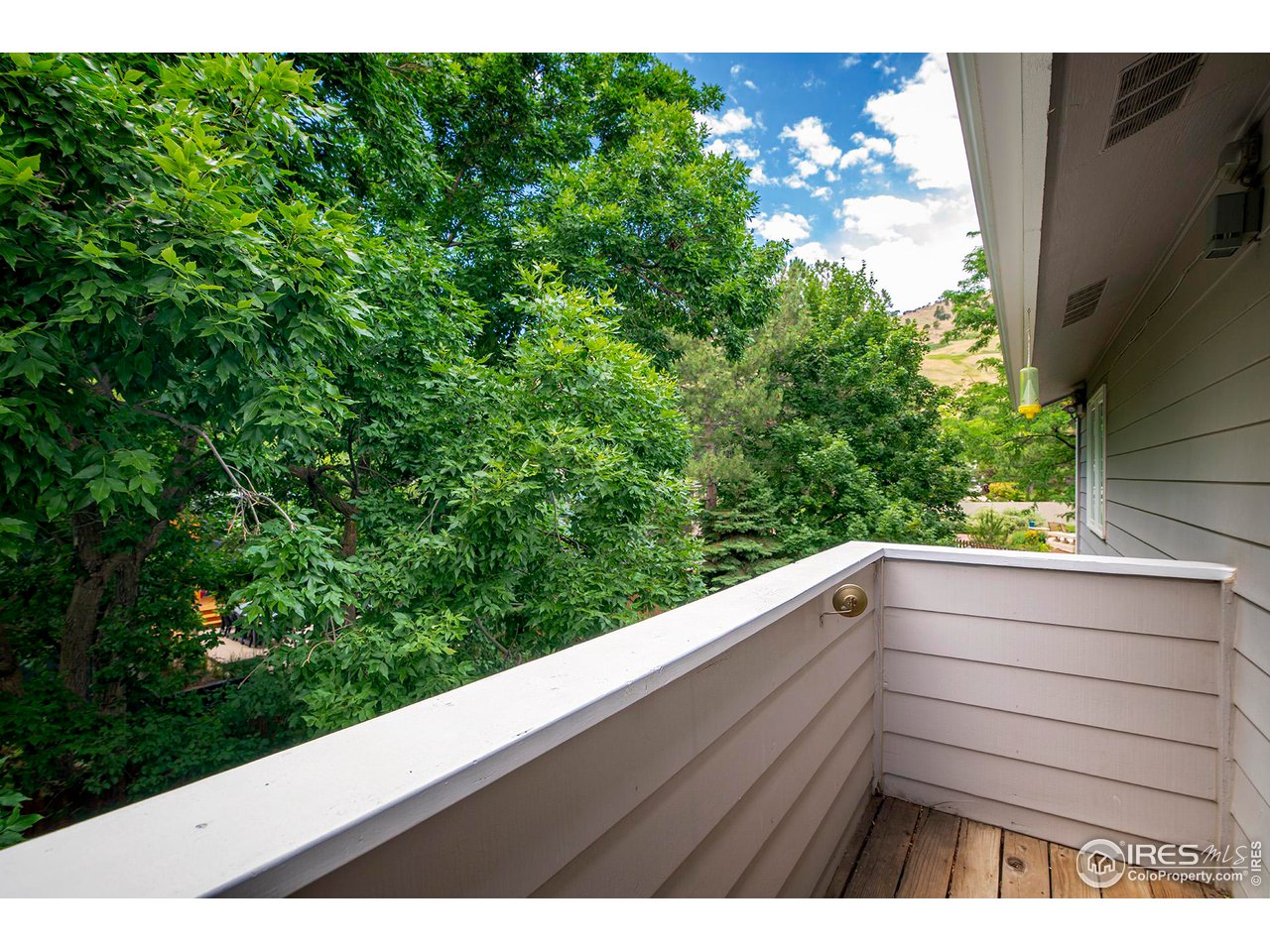476 Locust Place Boulder, CO 80304 - Photo 22 of 38 a view of balcony with wooden floor
