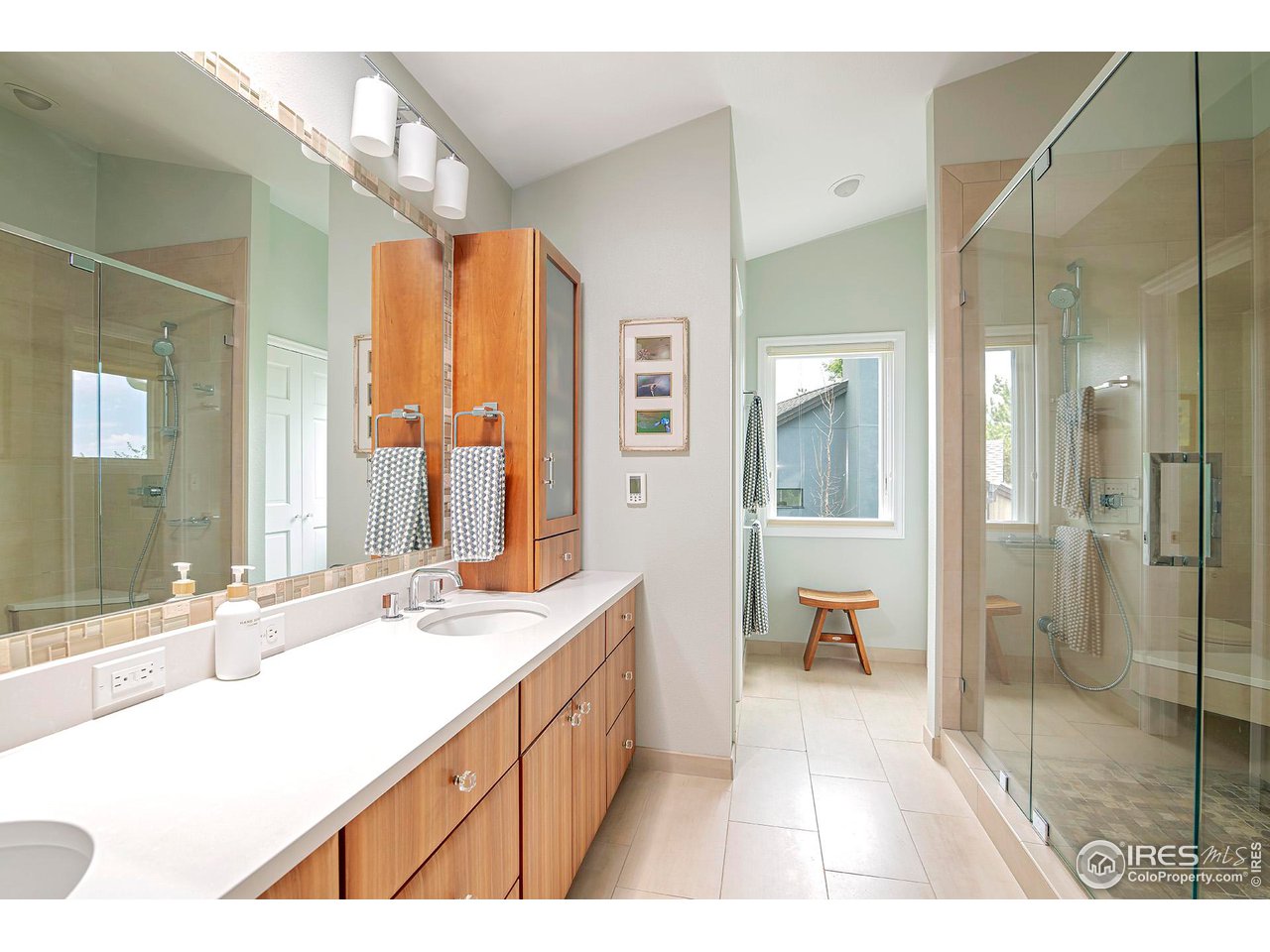 476 Locust Place Boulder, CO 80304 - Photo 23 of 38 a bathroom with a double vanity sink mirror and shower