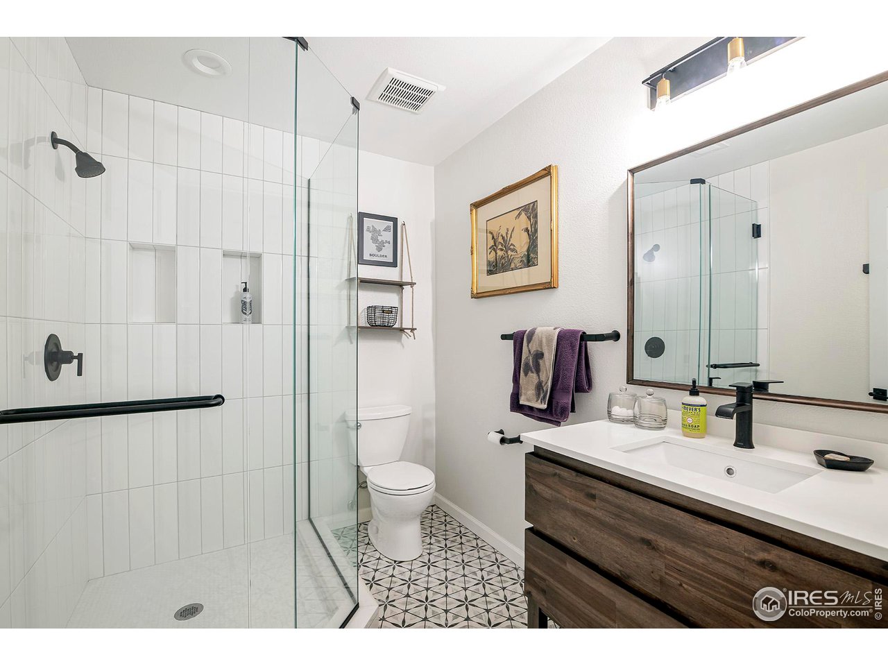 476 Locust Place Boulder, CO 80304 - Photo 32 of 38 a bathroom with a sink toilet a mirror and shower