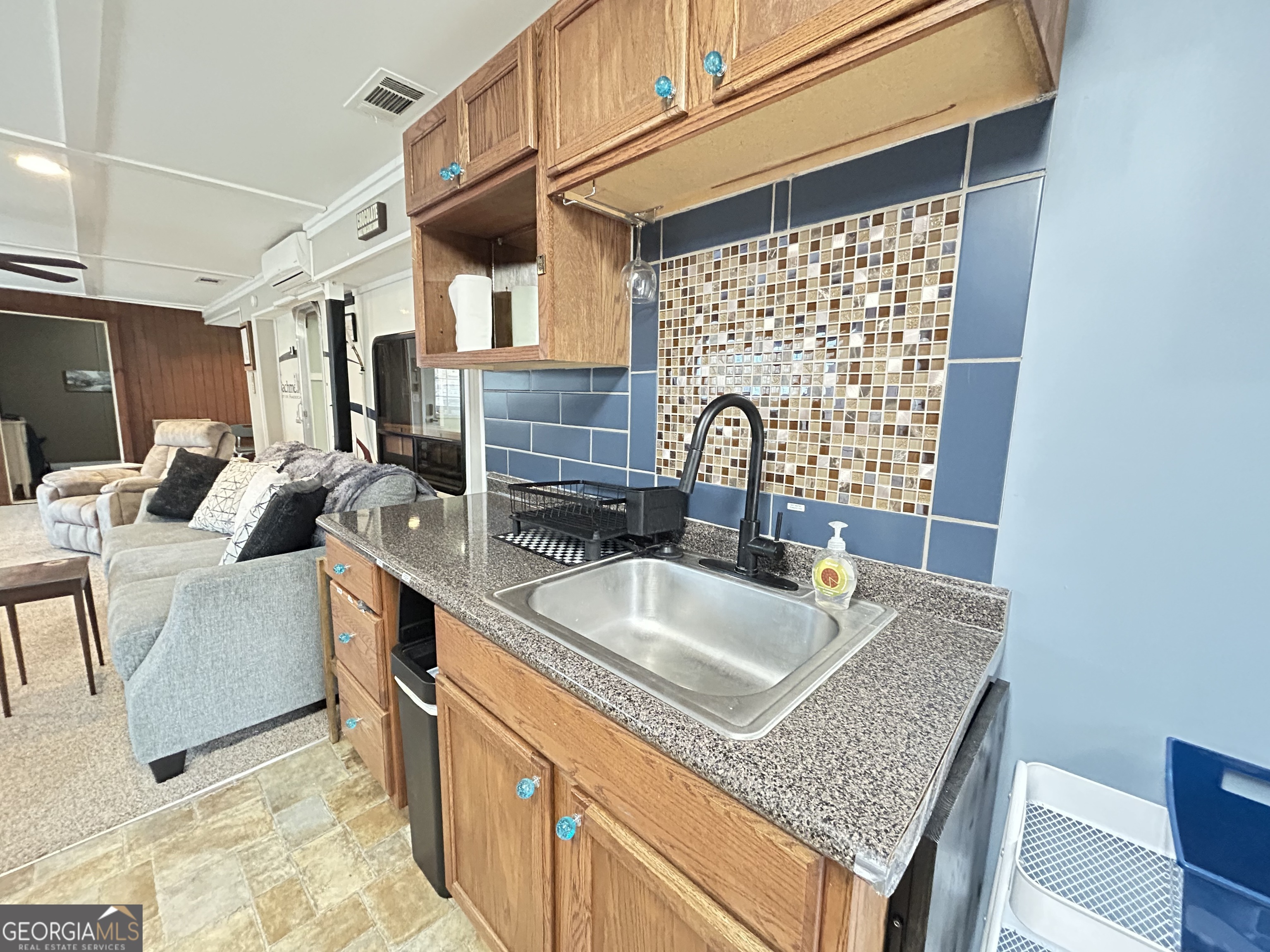 6 Grove Lane Cleveland, GA 30528 - Photo 13 of 40 a kitchen with granite countertop a sink and a wooden cabinets