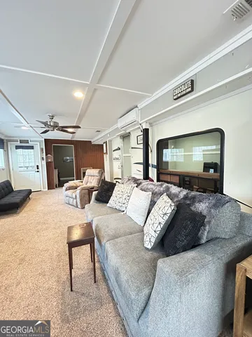 a kitchen with stainless steel appliances kitchen island granite countertop a sink and cabinets