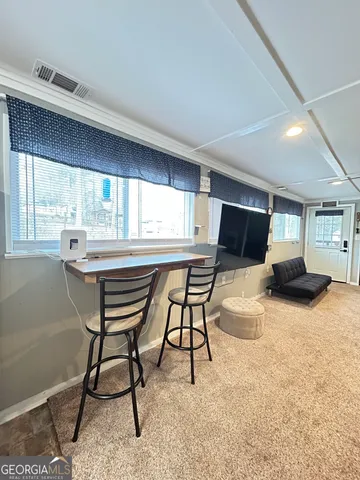 a living room with furniture and a couch