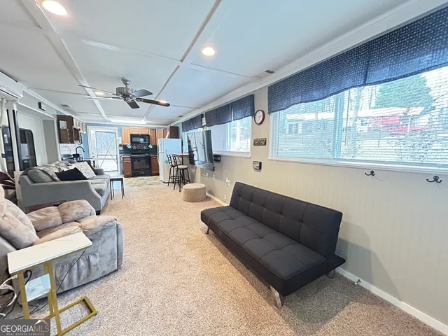 a living room with furniture window and a table