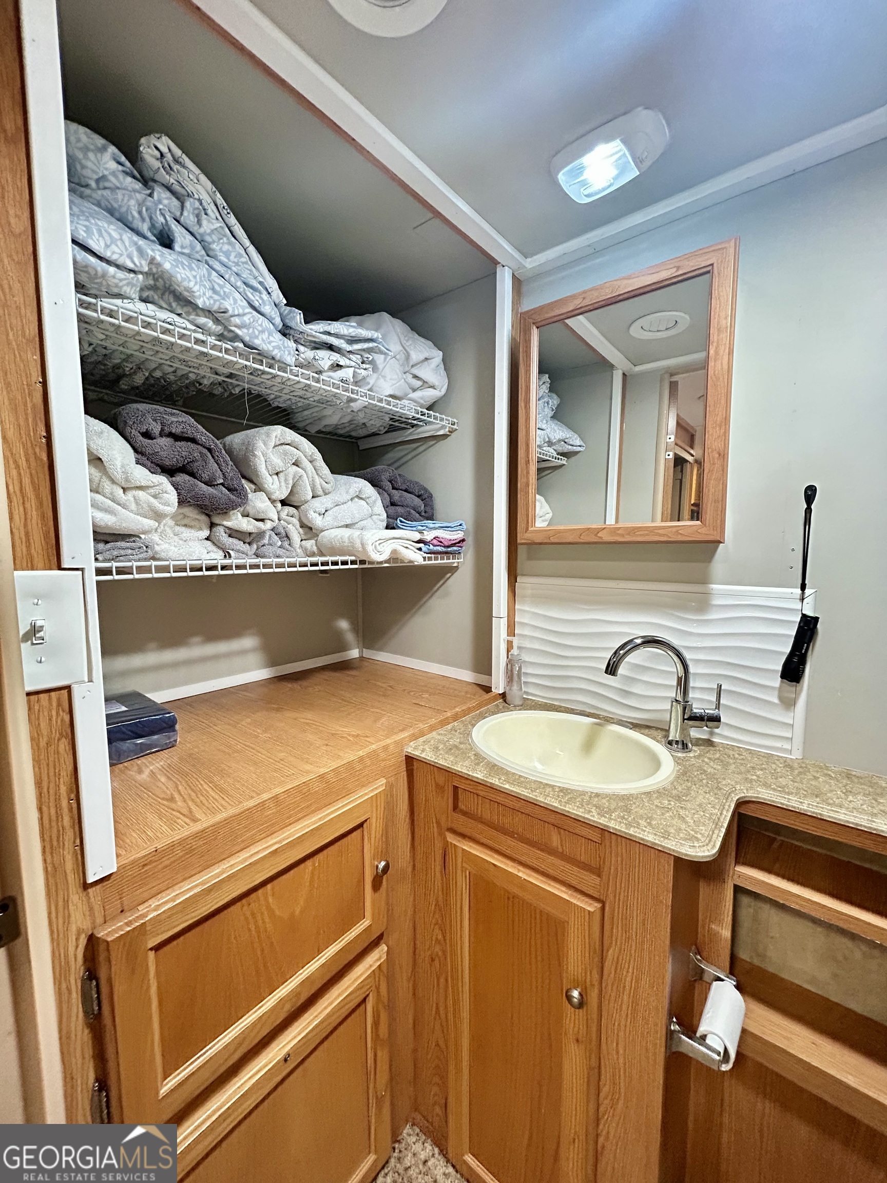 6 Grove Lane Cleveland, GA 30528 - Photo 29 of 40 a bathroom with a sink and a mirror