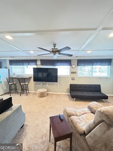 a bedroom with a bed and chandelier