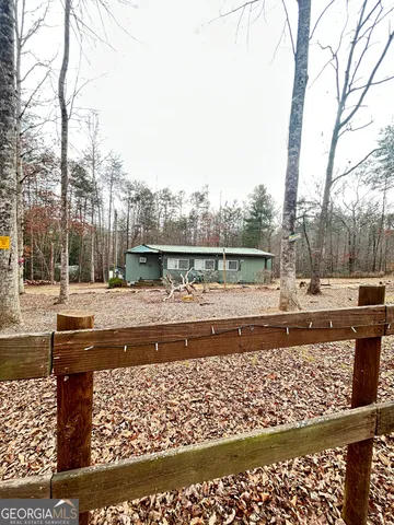 a view of swimming pool with a yard and sitting area
