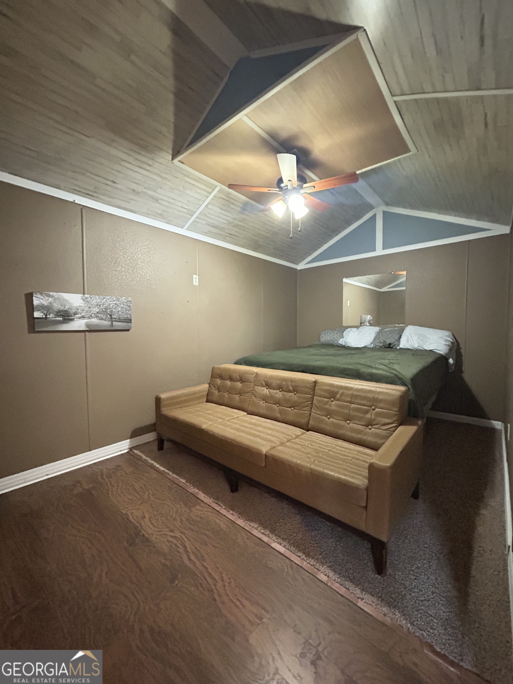 6 Grove Lane Cleveland, GA 30528 - Photo 31 of 40 a bedroom with a bed and chandelier