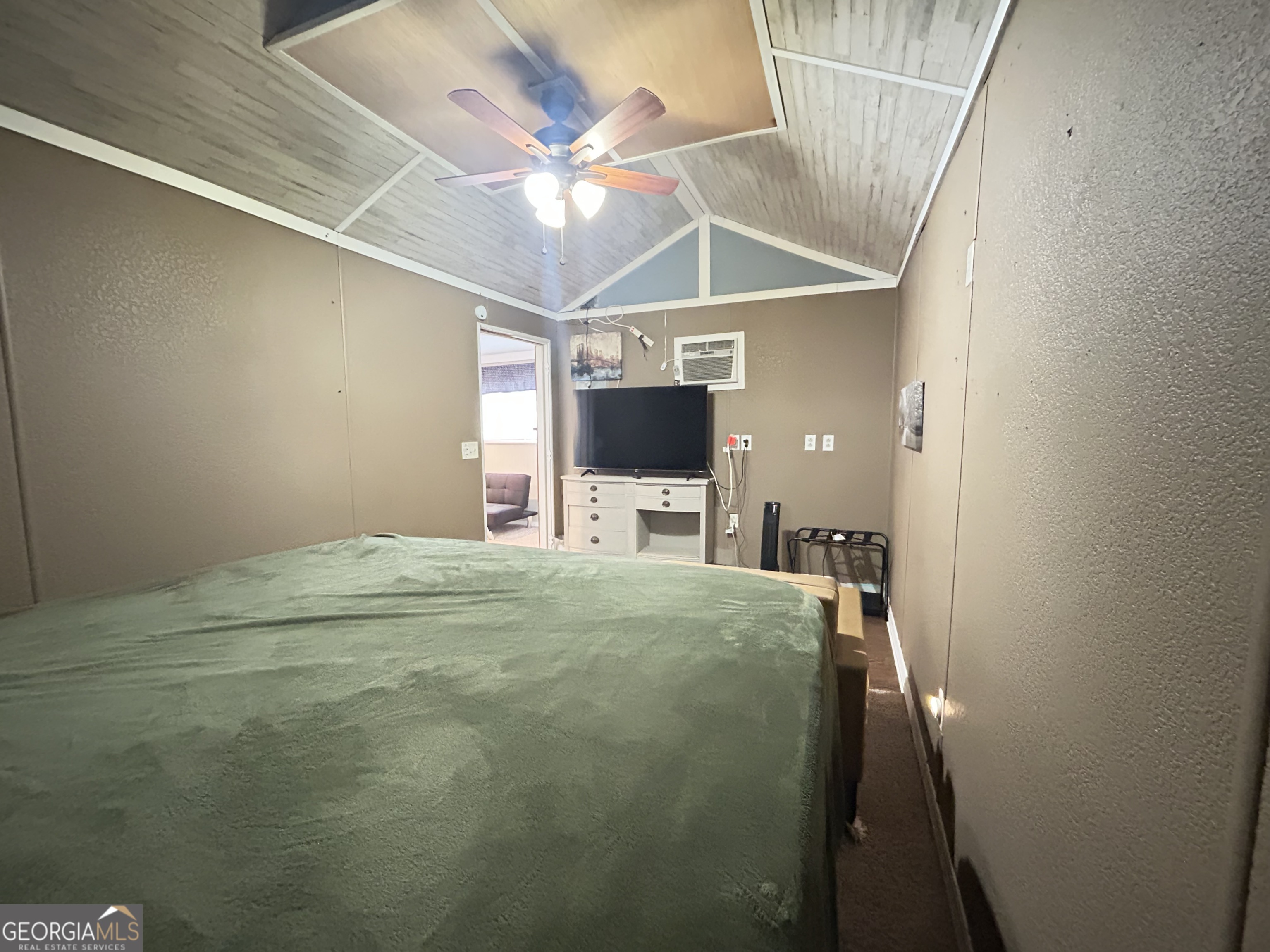 6 Grove Lane Cleveland, GA 30528 - Photo 32 of 40 a bedroom with a bed and a chandelier